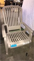 Reclining molded plastic chair with foot support