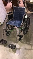 Folding wheelchair with foot rest, tracer, model
