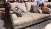 Beige corduroy loveseat with two designer pillows