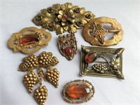 7 Brass look brooches - vintage some with sets