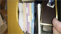 lot of office supplies including envelopes, maps,