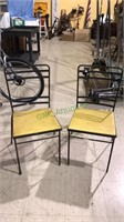 Pair of vintage black metal chairs with yellow