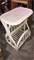 White bamboo side table with a magazine rack, 23