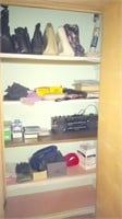 contents of hallway closet includes purses,