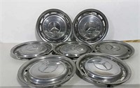 Seven Mercedes-Benz hubcaps