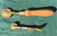 Two brass pie crimpers