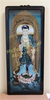 AN ORIENTAL DIETY HAND PAINTED ON GLASS