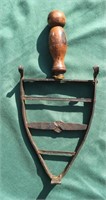 Early riveted sad iron stand with wooden handle