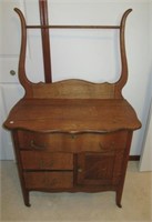 Antique oak wash stand with towel bar. Features