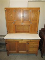 Antique kitchen cupboard with porcelain top.