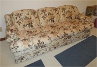 Floral upholstered sofa sleeper in rose beige