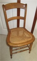 Vintage cane bottom chair with back.