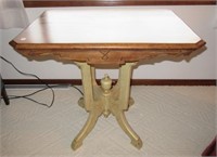 Wood side table with decorative designed legs.