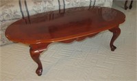 Wood oval coffee table. Measures 15" h x 46" w x