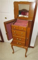 Four drawer standing jewelry cabinet with side