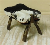 Camel Saddle Stool with Cow Hide Seat.
