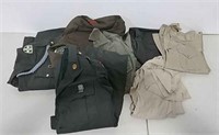 Lot of military uniforms, shirts, and pants