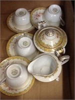 Box of porcelain cups and saucers