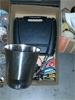 Box of tools and stainless steel wastebasket