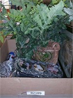 Box of artificial plant and glass picture frames