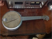Miniature metal Dixie banjo.