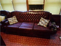 Nice Maroon and black colored leather look couch