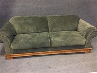 Green Sofa with a Western Style Wood Base