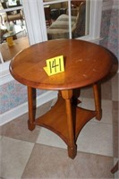round table with lower shelf
