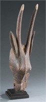 Antelope style headdress with carved bird figure.
