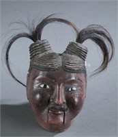 A Myanmar traditional wooden female puppet head.