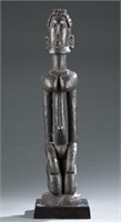 Dogon kneeling female figure. c.20th century.