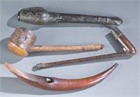 A group of pipes and utensils