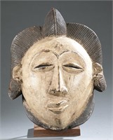 Punu style polychrome mask. c.20th century.