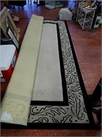Large black and cream area rug