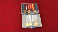 two boxes of three Coast Guard medals