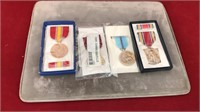 four large Coast Guard medals
