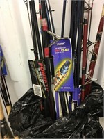 Large lot of fishing poles, some with tags, all lo