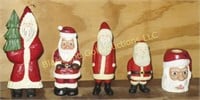 Lot of 4 wooden Santa figures