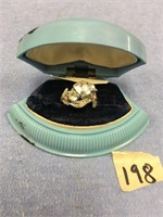 Ladies' wedding ring in an antique blue box has ar