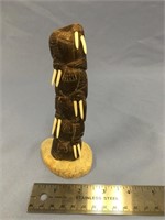 A fabulous dark bone carving, 6.5" carving with fi