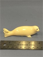 4" ivory carving of a seal with inset baleen eyes