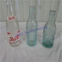 3 glass pop bottles