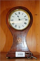 Antique mahogany cased balloon form clock