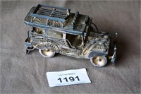 Sterling silver model of a local mini bus,