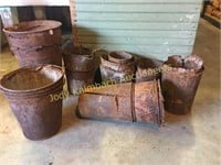 Lot of old rusty sap buckets for fall planting