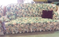 Flower upholstered couch,  tufted back, wood trim