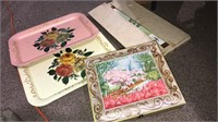Large chocolate candy tin, two Tole Ware trays,
