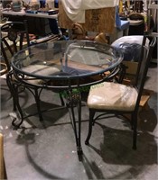 Metal glass top table into metal chairs with