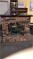 Real brick fireplace surround & base with wood