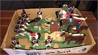 Group of wooden soldiers including some on
